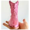 Botas vaqueras para niñas en color rosa metálico.